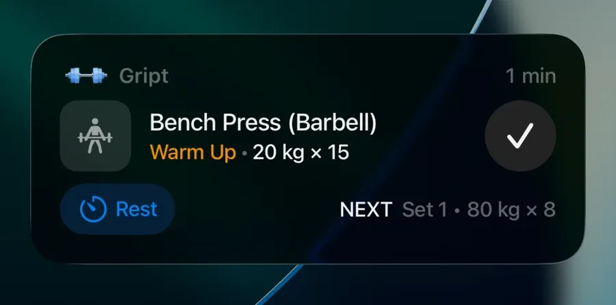 The Gript Live Activity on the iPhone lock screen showing the current bench press set with a complete button and Rest button